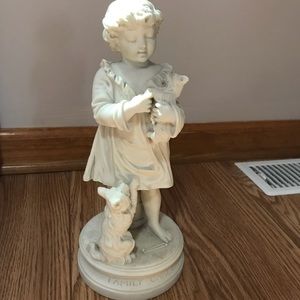 Family Cares Boy with Dogs Statue